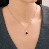 Подвеска из серебра с позолотой, гранатом и фианитами